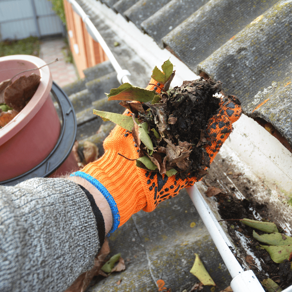 Removing dirt from a gutter